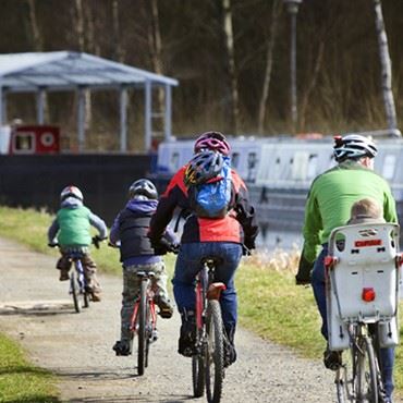 Family Cycling Along Canal Towpath At The Falkirk Wheel C Peter Sandgroundjpg