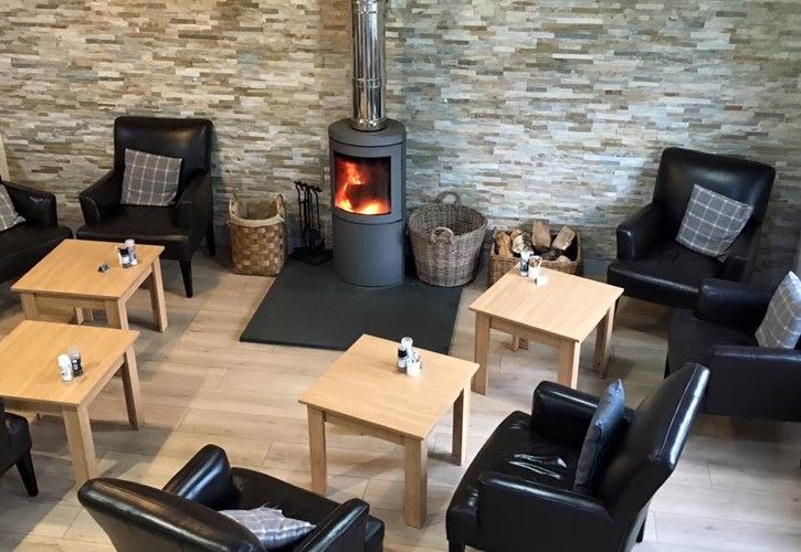 Mannerston Farm Shop & Cafe interior leather seats and wood burning stove